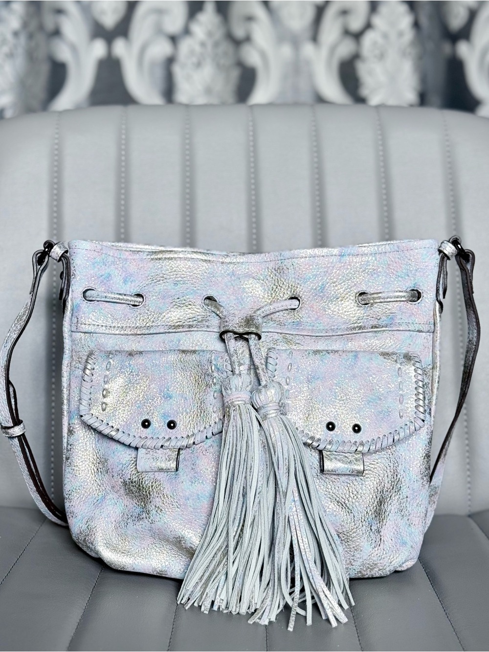 Aimee Kestenberg Iridescent Silver Tassel Drawstring Crossbody Bag